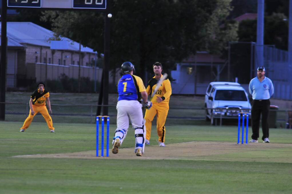 CRICKET: Blayney's Jason Stanbridge bowls to Orange City's Dave Boundy in a Royal Hotel Cup game at Wade Park on Friday night. Photo: JUDE KEOGH