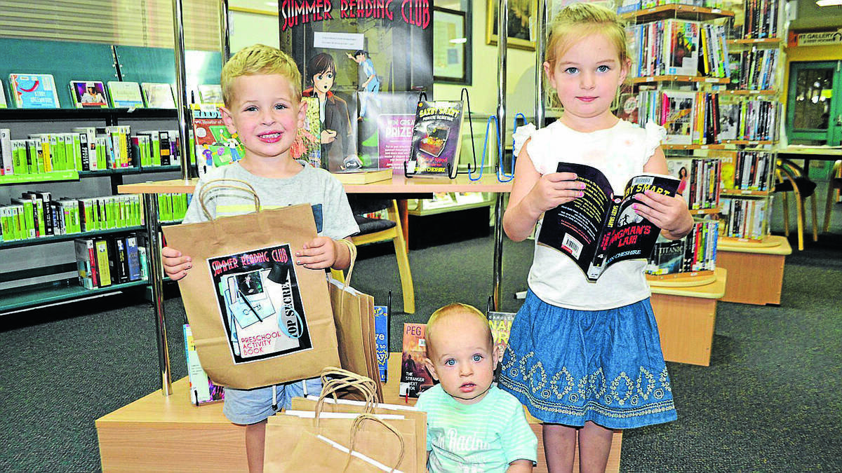 COWRA: Serious sleuths, Patrick, Jacob and Makenna Rowston check out some of the the investigative novels currently on display at the Cowra Library.