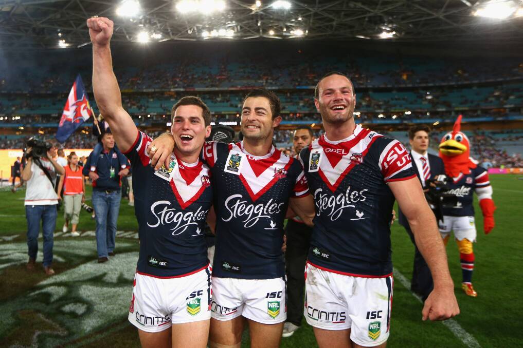 MIGHTY MORT: Daniel Mortimer (left) celebtrates winning the 2013 NRL grand final with his Sydney Roosters team-mates Anthony Minichiello and Boyd Cordner. Photo: GETTY IMAGES