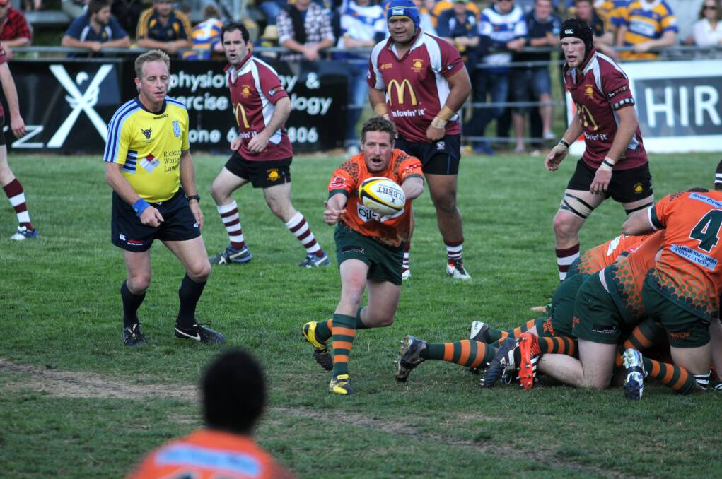 THERE YOU GO: Orange City halfback Nick Quinn gives the ball out in the grand final.