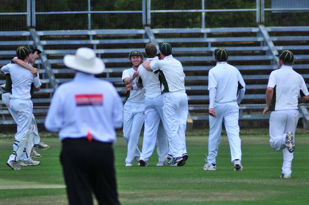CRICKET: CYMS celebrate a wicket in Saturday's ODCA first grade one day final at Wade Park. Photo: JUDE KEOGH