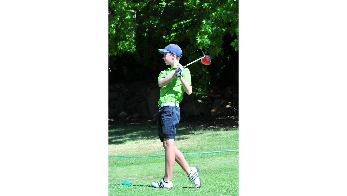 GOLF: Chris Moran watches his drive in the Wentworth Junior Classic. Photo: JUDE KEOGH