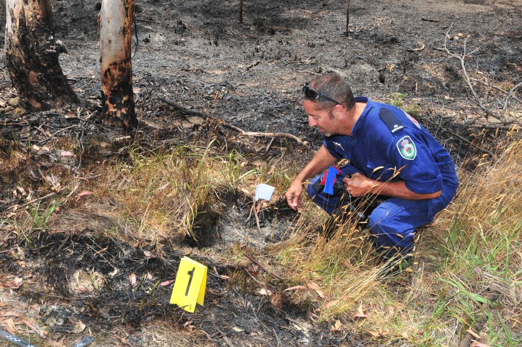 ROADSIDE BLAZE: NSW Rural Fire Service Canobolas Zone fire investigator Mike Spira was quick on scene to investigate a suspicious fire north-west of Orange on Monday morning. Photo: LUKE SCHUYLER 1230lsfire
