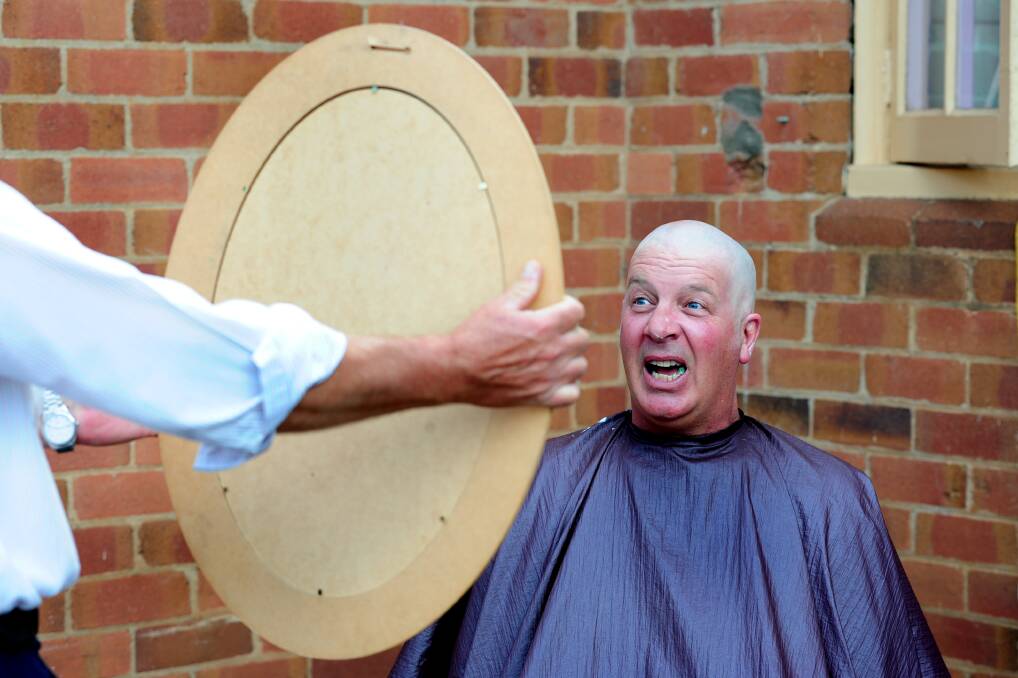 CLEAN LOOK: Jeff Grindrod checks his new look in the mirror, published Thursday, March 14. Photo: STEVE GOSCH