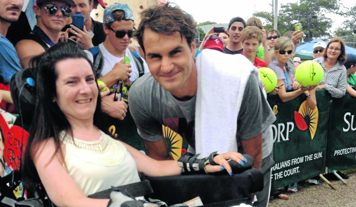 ORANGE: WHAT A THRILL: Nicole Sugden was lucky enough to meet her tennis hero Roger Federer after a practice session at the Brisbane International Tennis Tournament on Tuesday. Photo: CONTRIBUTED