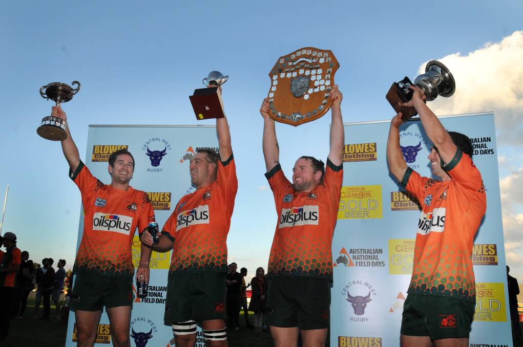WE DID IT: Orange City players Sam Coote,Chris Barrett, Josh Tremain and Michael Sparks celebrate the Lions' second undefeated premiership in a row.