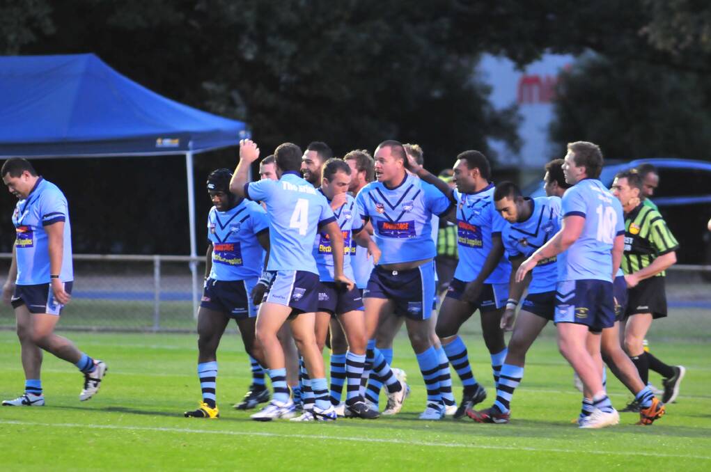 CELEBRATION: Hawks players celebrate Arty Shead's try in the local derby win.