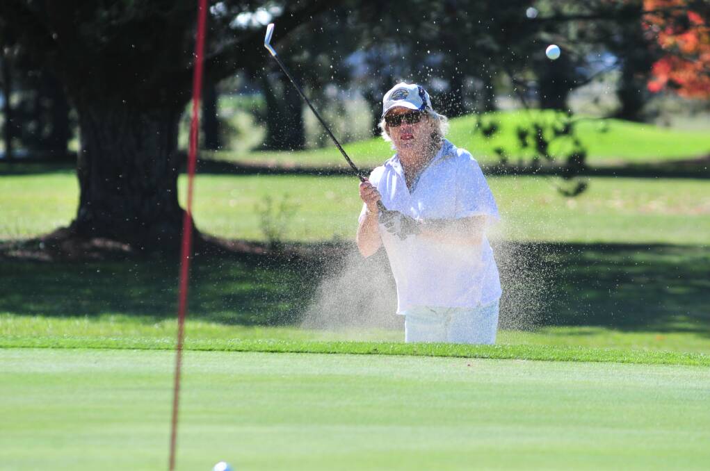 SAND: Val Lynch escapes a trap at the Ex-Services Country Club course.