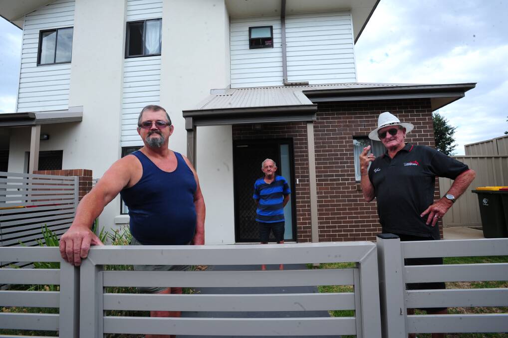 NOT HAPPY: Jubilee Avenue residents Arthur Kinchela, David Seott and Pat Alderton want Housing Plus to act on their unruly neighbours. Photo: STEVE GOSCH