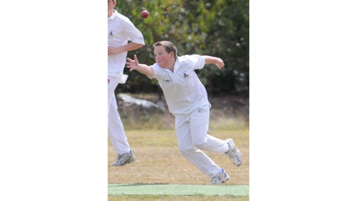 CRICKET: Ryan Beckett tries to snare a catch as Cavaliers played SJS-CYMS on Saturday. Photo: STEVE GOSCH