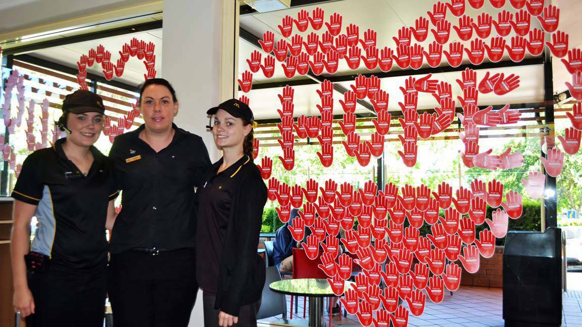 COWRA: Cowra Shire residents helped to raise $2847 for McHappy Day last year according to recently released figures. Ash Eastwood, Catherine Anderson and Emma Melton are pictured getting ready for this year's McHappy Day.