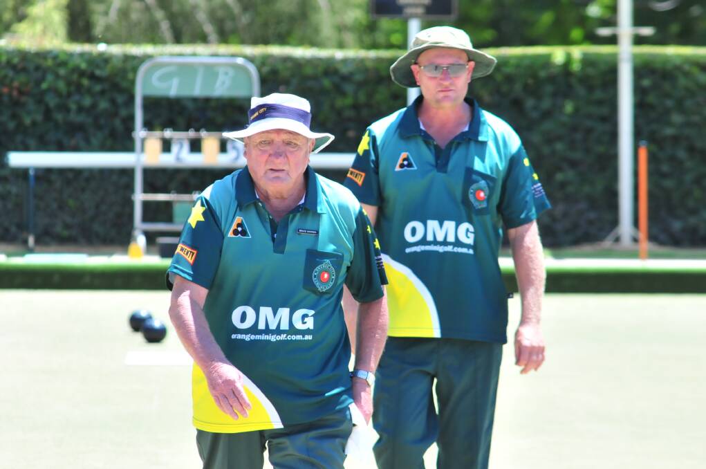 BOWLS: Bruce Warren and Deon May on the green at Orange City Bowling Club on Saturday. Photo: JUDE KEOGH