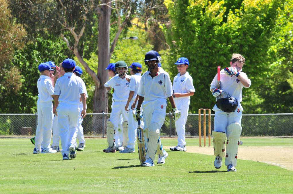 North Shore's Sohal Kharwadkar and Ben Rae walk off Riawena Oval against ACT under 12s on Monday. Photo: JUDE KEOGH