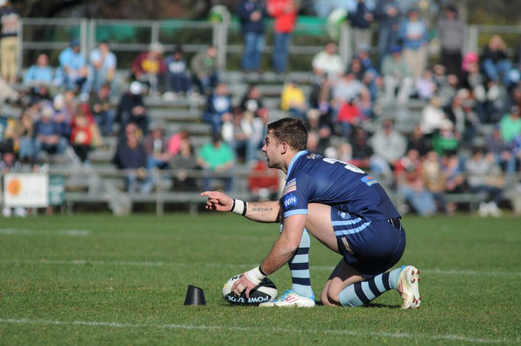 CONCENTRATION: Hawks Brock McGarity lines up a conversion in the Group 10 major semi-final.