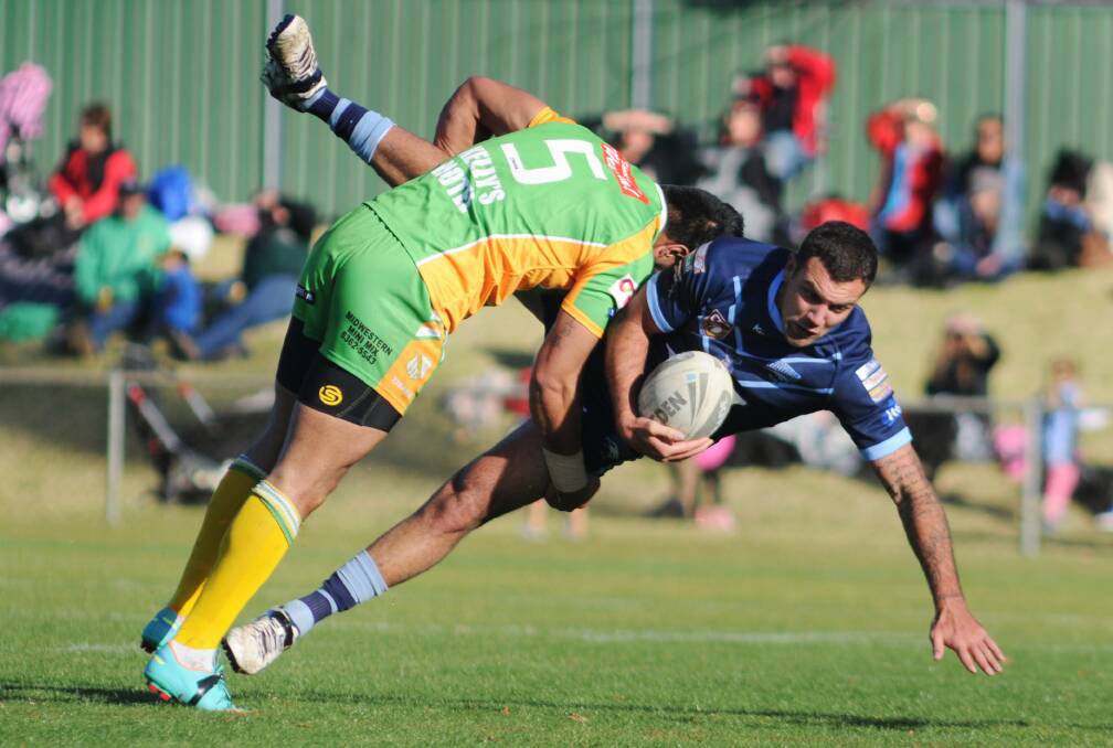DERBY DUMP: Jarod Brodrick feels the full force of a Semisi Katoa tackle in the second derby of the season at Wade Park.