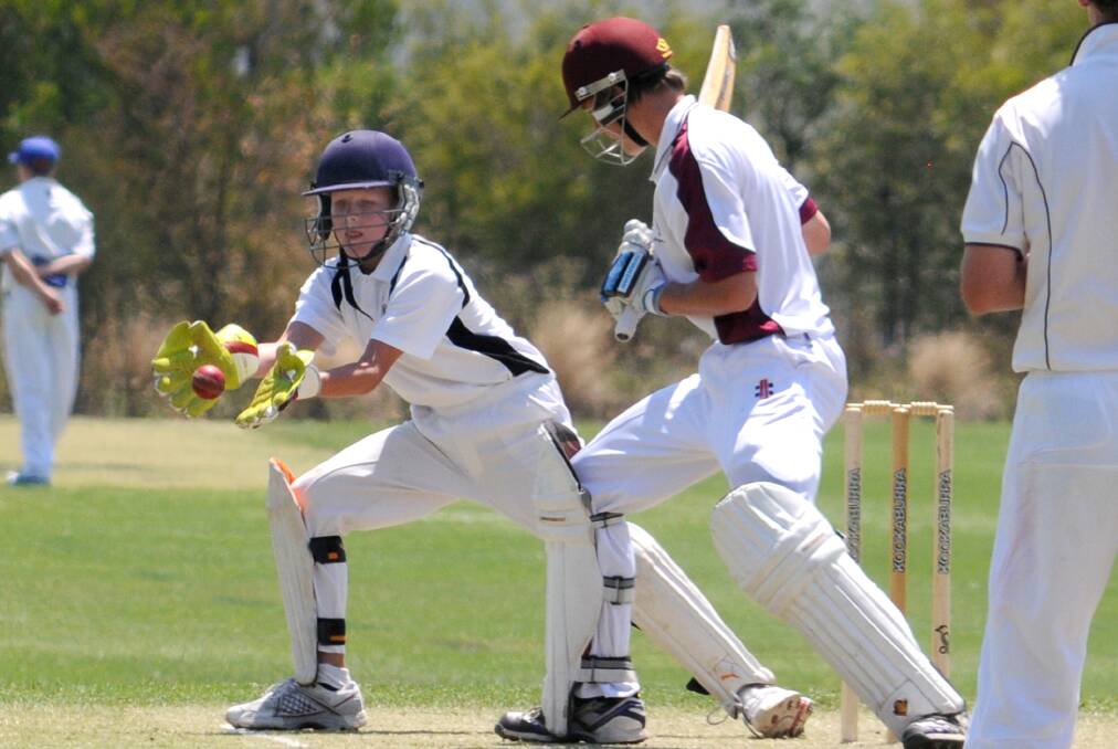 Mitchell wicketkeeper Donald Hern takes the ball as Shoalhaven's Dane Johnston watches in their sides' match at Sir Jack Brabham Park on Monday. Photo: STEVE GOSCH