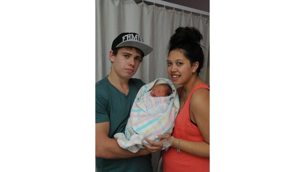 Jackson Julius, pictured with his parents Justin Julius and Kanita Aldridge, was born on December 17.