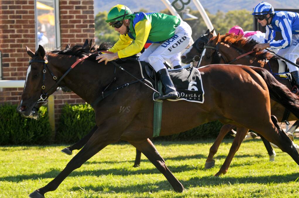 THAT WINNING FEELING: Ward and jockey Jay Ford win the Mudgee Cup on Friday. Photo: SANDY SMITH