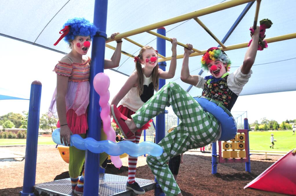 FUN AND GAMES: Kinross Wolaroi's Emma Pryce-Jones, Eloise Coleman and Joshua Cheney in a playful mood. Photo: JUDE KEOGH