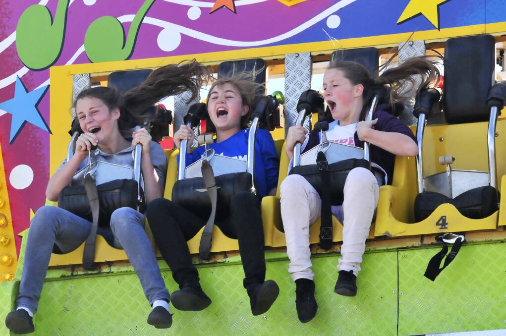 WHAT A RIDE: Bethany Johnson, Abbie Stedman and Drew Johnson at the Molong Show. Photo: JUDE KEOGH