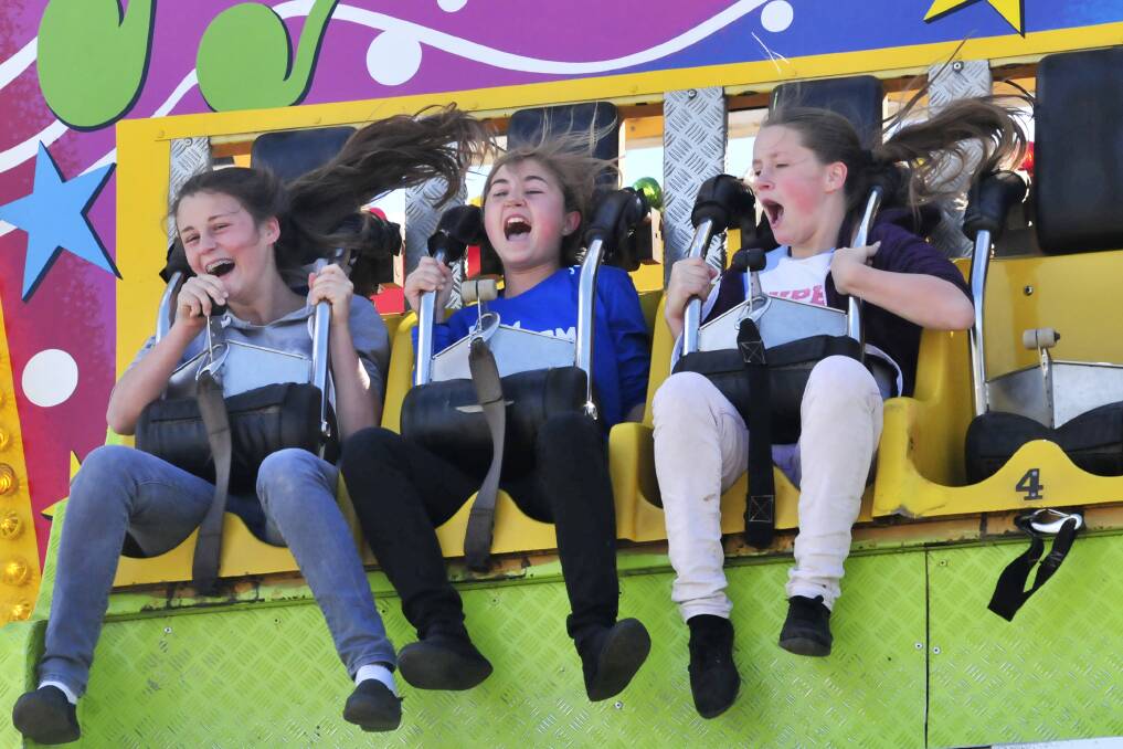 SWEET TERROR: Bethany Johnson, Abbie Stedman and Drew Johnson at the Molong Show, published on Monday, September 23. Photo: JUDE KEOGH