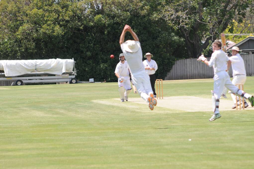 CRICKET: Kinross' Andy Litchfield dives for a catch in the slips off the bowling of his son Charlie in an ODCA first grade fixture on Saturday. The Centrals batsman is Mick Walker. Photo: LUKE SCHUYLER