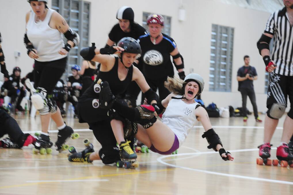 ROLLER TUMBLE: Moulin Bruise takes out jammer Hot Mess, published on Monday, March 25. Photo: JUDE KEOGH