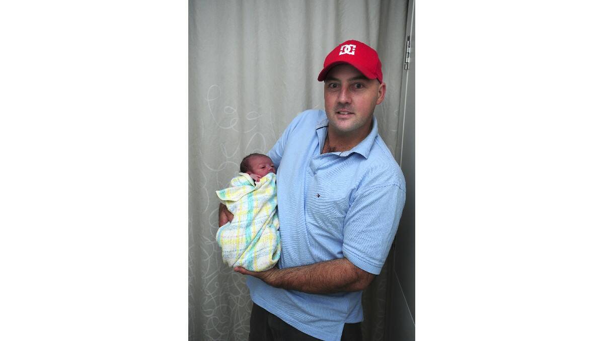 Darcy Webster, pictured with his father John Webster, was born on March 20. Darcy's mother is Fleur Webster.