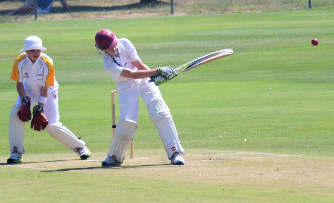 ACT Under Gold's Oliver Blayney-Brown hits out as South Coast wicketkeeper Blake Harrison watches on at Riawena Oval on Wednesday. Photo: MELISE COLEMAN