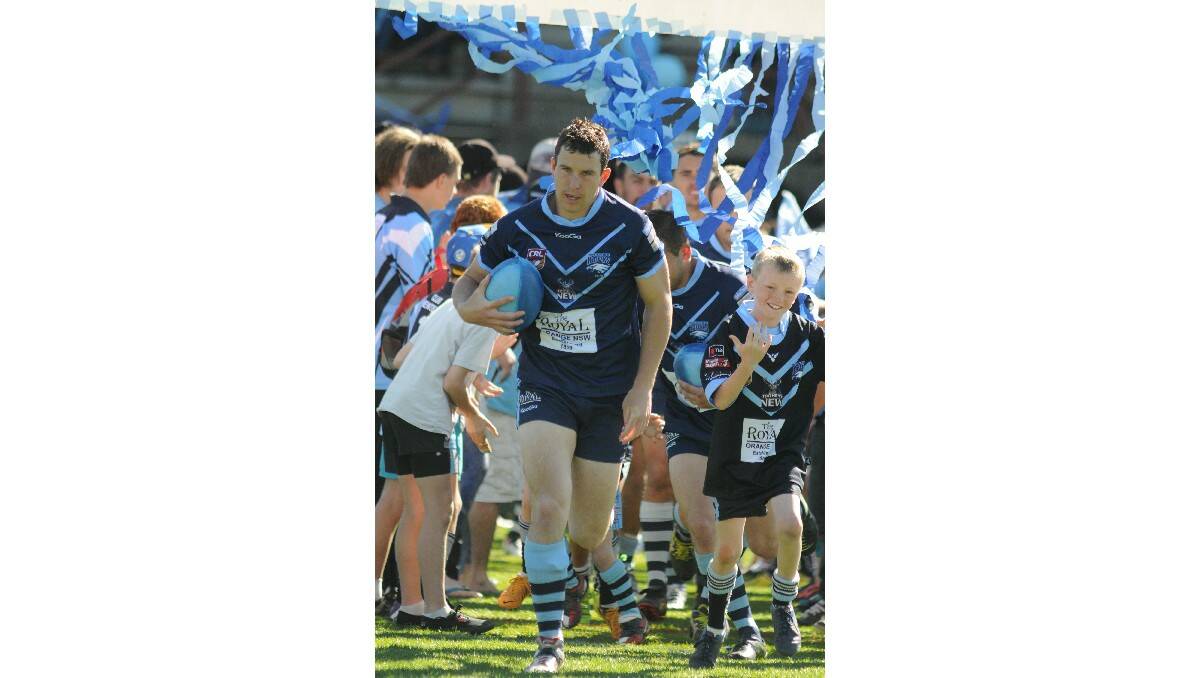 DETERMINED: Hawks skipper Tim Mortimer leads his team out for the Group 10 grand final.