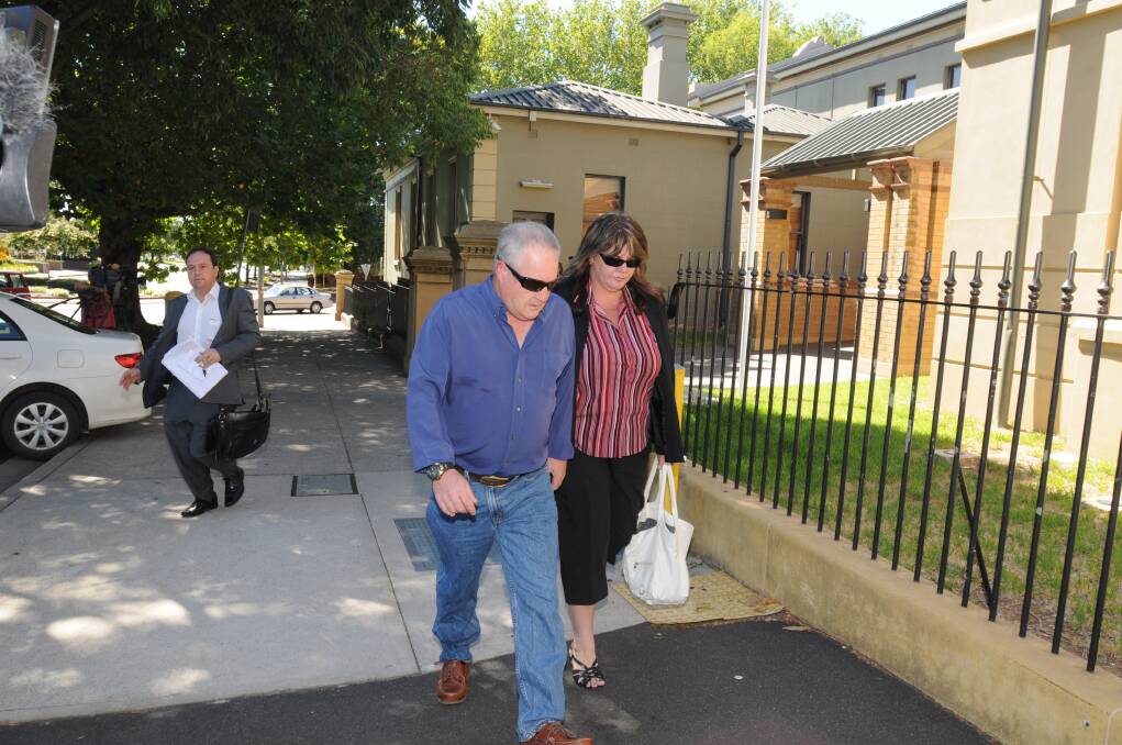 IN COURT: Alleged one-punch attacker Karl Sibley's mother and step-father leave Orange Local Court after the accused's hearing on Monday morning. Photo: STEVE GOSCH