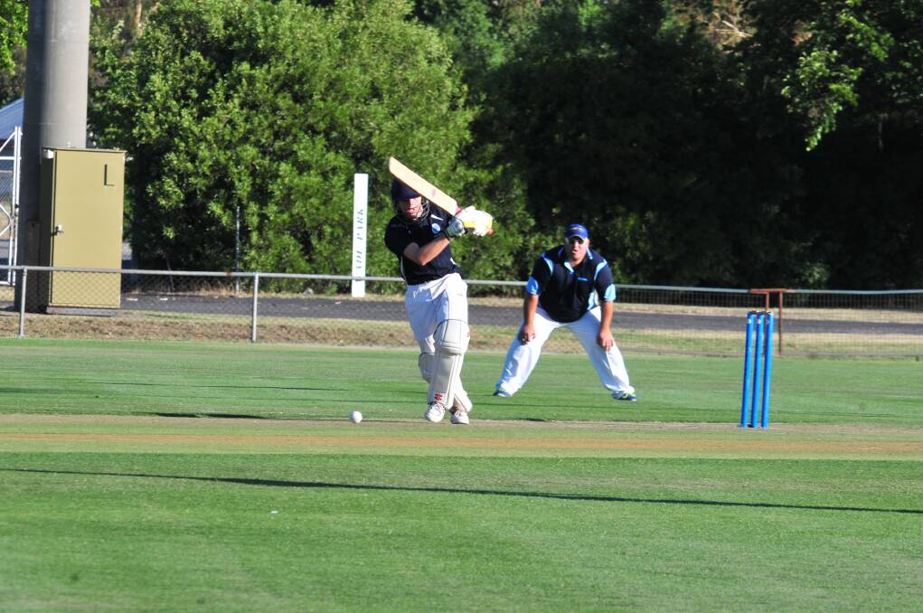 CRICKET: Kinross' Charlie Litchfield on the attack against Molong in Friday night's Royal Hotel Cup game at Wade Park. Photo: JUDE KEOGH