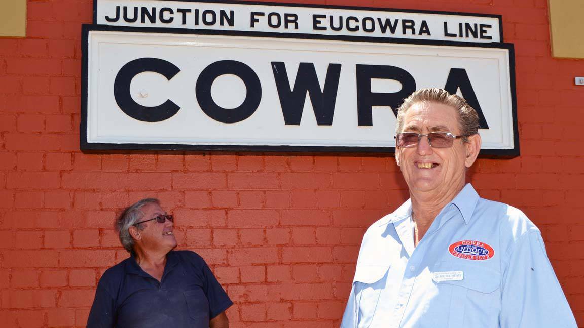 COWRA: Cowra Antique Vehicle Club's Russell Denning with president Laurie Trethewey at the historic railway station.