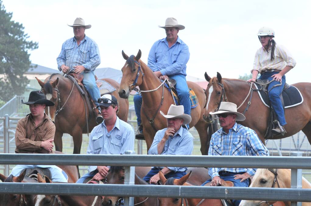 SADDLE UP: Competitors watch the riders in the yard at the Orange Campdraught. Photo: JUDE KEOGH