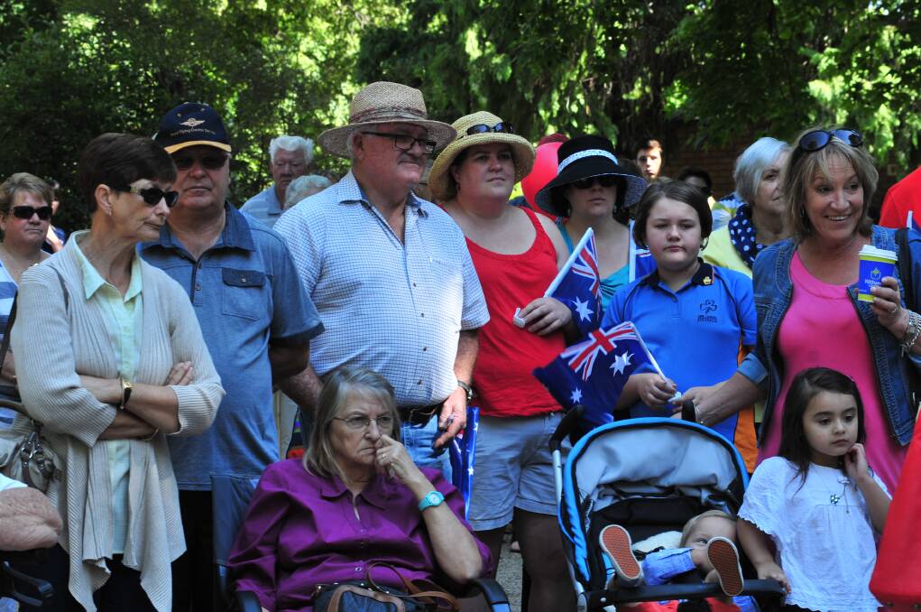 The crowd watches the Australia Day presentations at Cook Park on Sunday. Photo: JUDE KEOGH