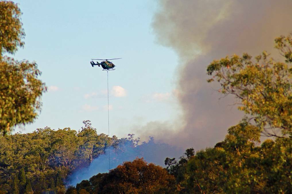 ORANGE: Fire crews worked through the night on Tuesday to contain a blaze that burnt out around 130 hectares of isolated pine forests north of Orange and 26 hectares of a state conservation area in Mullion Creek. Photo: ADAM ROBERTS