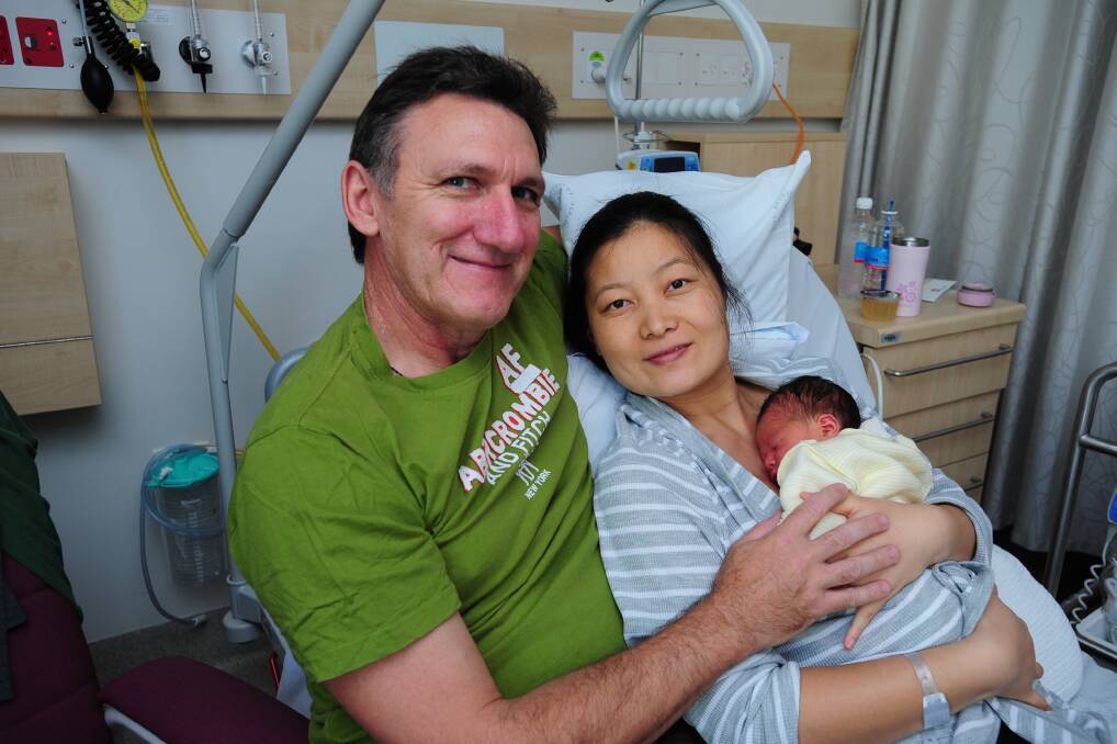 Charlotte Gurr, pictured with parents Geoff Gurr and Jian Lui, was born on February 23.