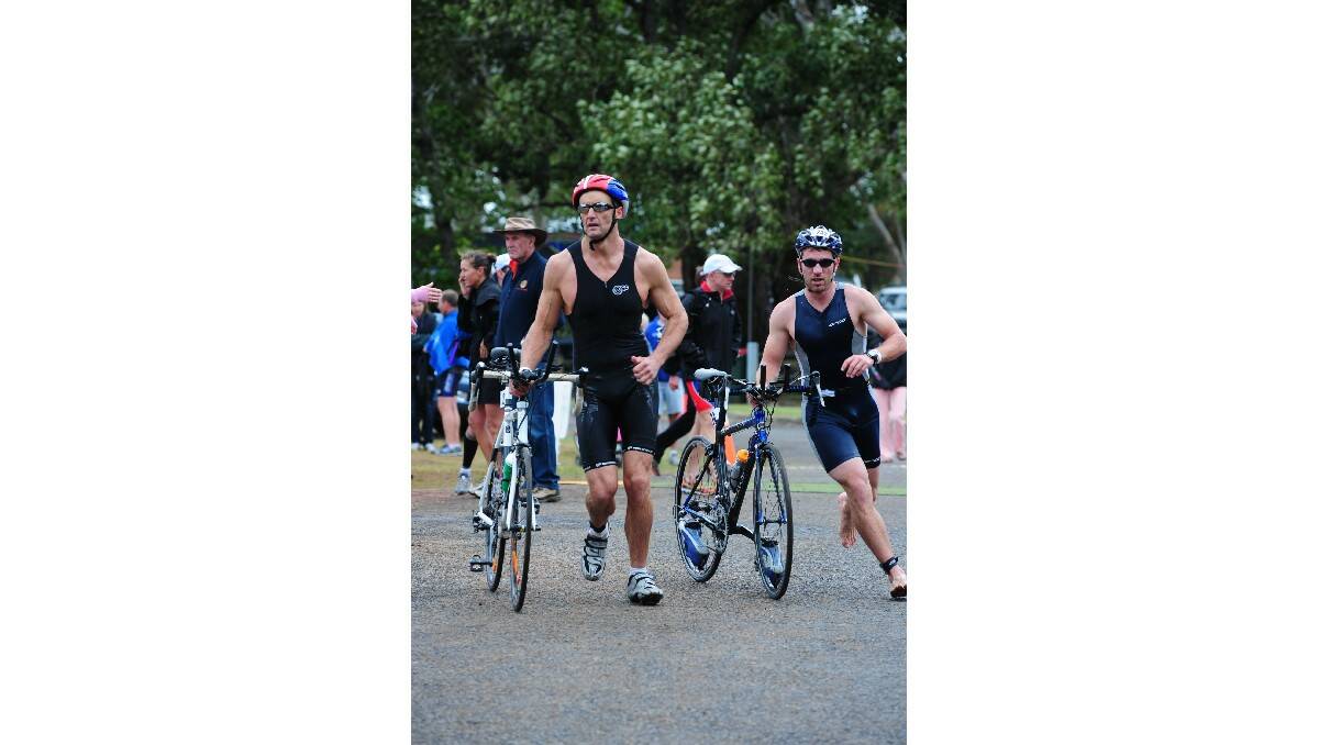 PEDAL POWER: Two Piranhas look to get ahead during the cycle leg of the inter-club series triathlon in Orange.