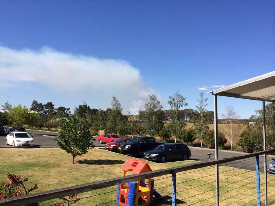 FIGHTING THE FIRE: Images of the blaze that has burnt out over 150 hectares at Mullion Creek, north of Orange. Photo: CAROLINE PITNEY