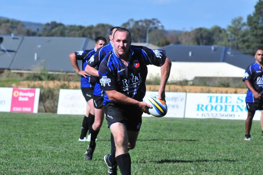 TURNING BACK THE CLOCK: Jamie Corcoran shifts the ball wide during the Orange City 10s