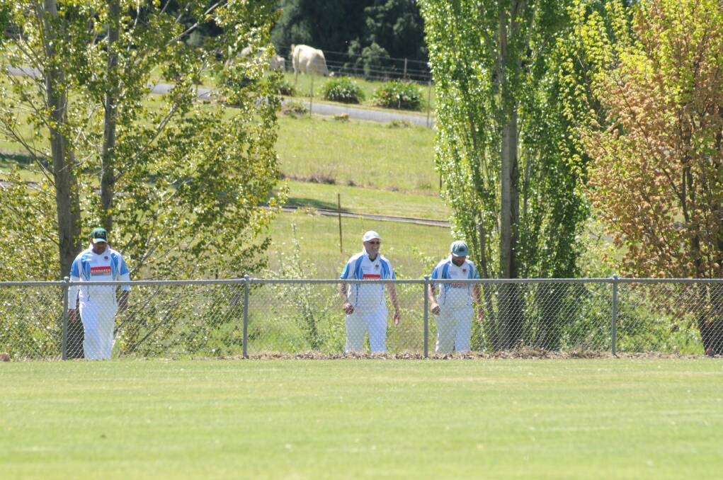 GOT IT: Waratahs fieldsman return from finding a six into the creek at Riawena Oval. Three balls were lost that day.