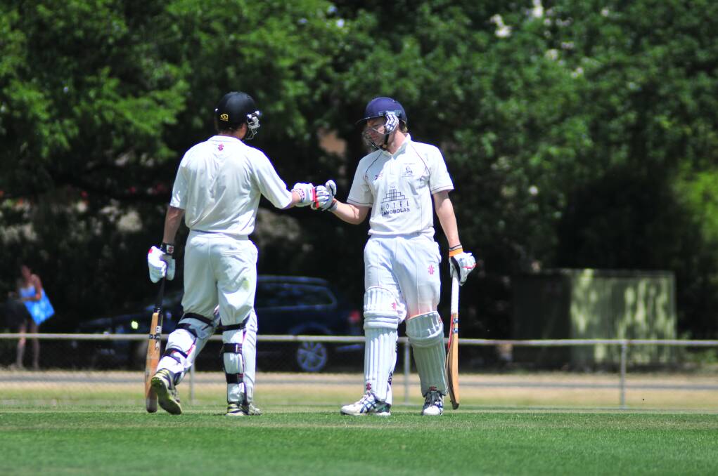 CRICKET: Cavaliers' Matt Corben and James Ryan against CYMS in the ODCA first grade one day final at Wade Park on Saturday. Photo: JUDE KEOGH