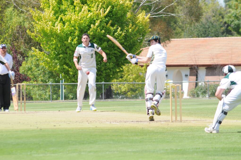 Orange City's Ed Morrish bowls to CYMS' Pat Madden in the ODCA first grade game at Riawena Oval on Saturday. Photo: LUKE SCHUYLER