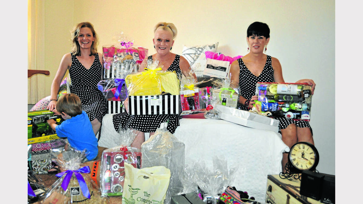 PARKES: Nicole Rosser, Jacinta Rawson and Nicole Ross amongst some of the fabulous prizes up for grabs at the TransTank Miss Priscilla Dinner. Photo: BARBARA REEVES