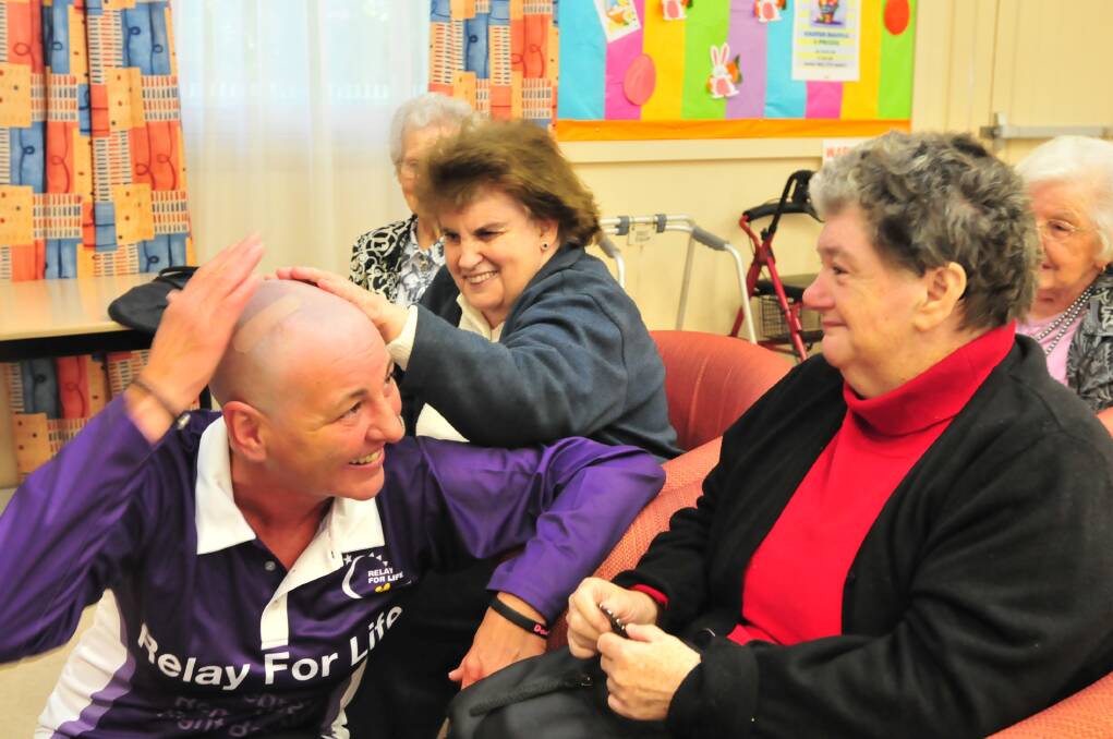 CLEAN CUT: Jo Whiley shows Libby Ryan, Maureen Ensor and Dorothy McCarron her new do after shaving her hair to raise money for the Relay for Life. Photo: JUDE KEOGH