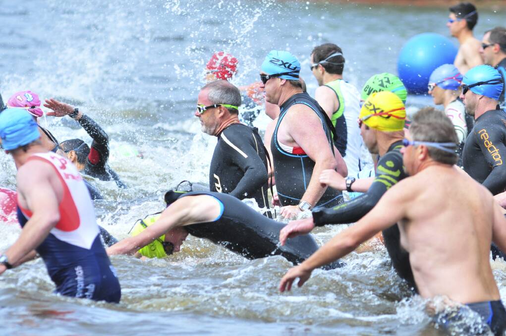SPLISH SPLASH: competitors in the Orange round of the Central West Inter-Club Triahtlon series makes waves at the race start.