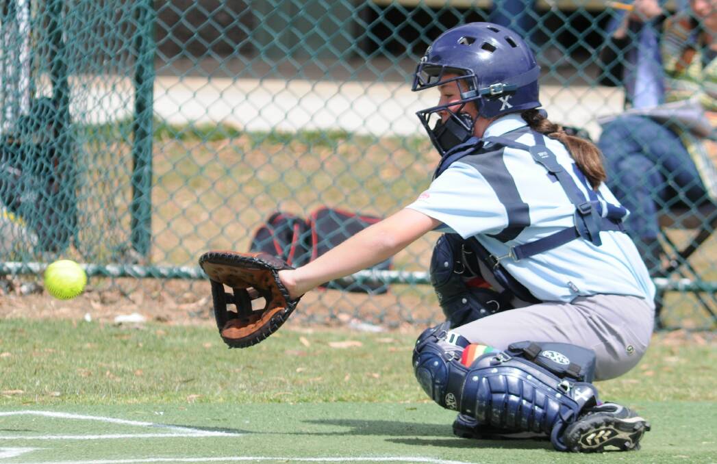 SOFTBALL: Chelsea White of the Blue Bloods catching on Saturday. Photo: STEVE GOSCH