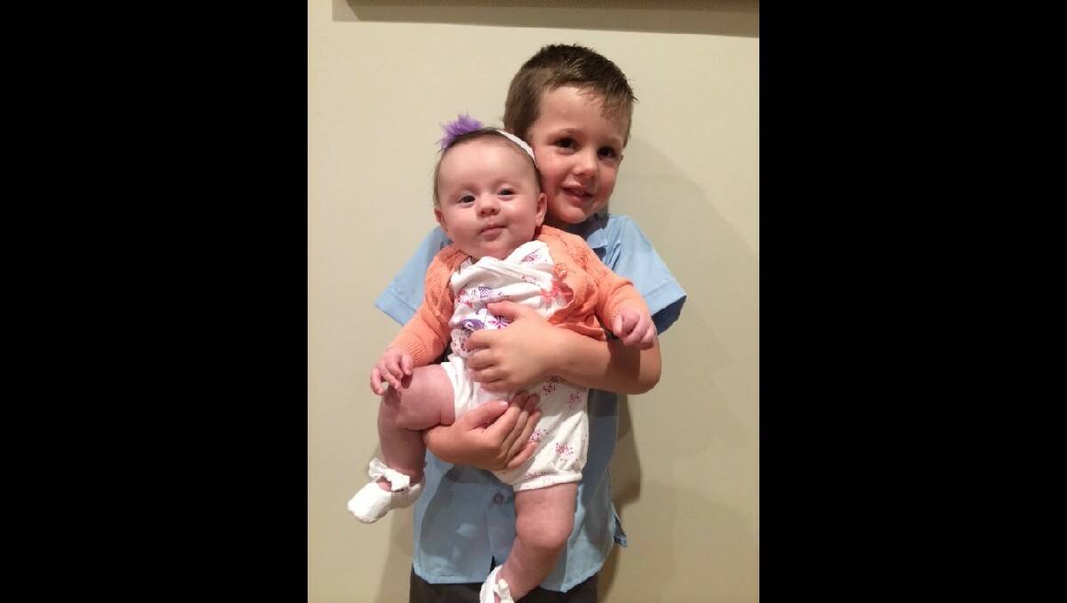 Cooper, with his baby sister, all ready for his first day of 'big school'. Photo: JADE EBERHARD