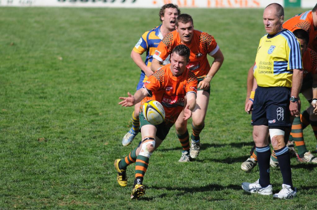 OFFLOAD: Orange City second grade halfback Anthony Kent gets a pass away. 