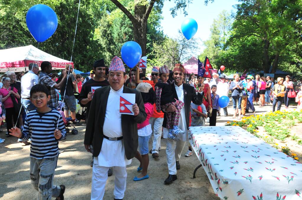 Members of the Orange community in a parade showing off their multicultural heritage. Photo: JUDE KEOGH